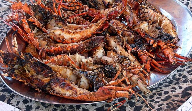 Pranzo a base di aragosta e gamberi alla griglia Sardegna Due